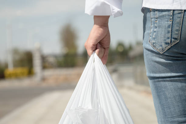 Woman holding a plastic bag