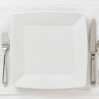 Contemporary table place setting; white on white; area for copy left open